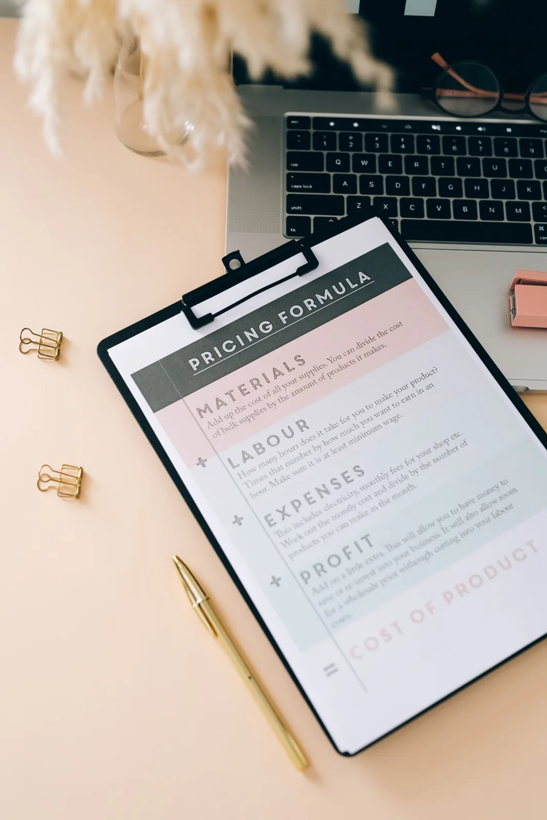 Printed form on a clipboard with a pen on a desk