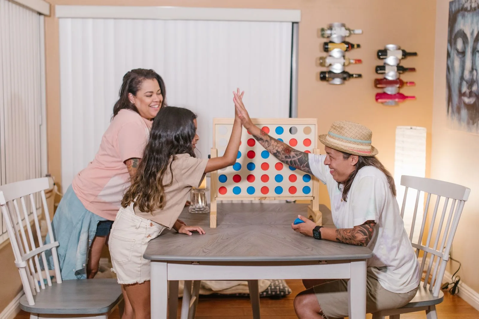 Family sharing a board game at home